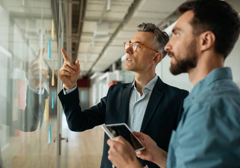 Business people meeting planning start up, talking, discussing ideas, brainstorming.